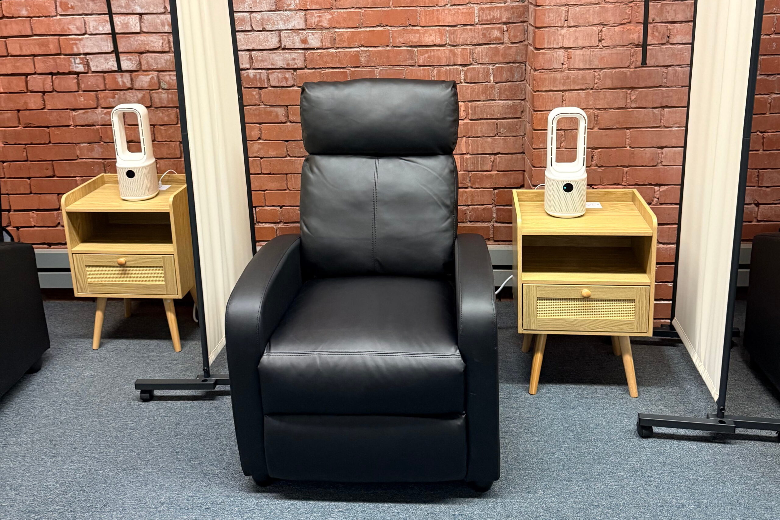 end tables with black recliner at ketamine clinic