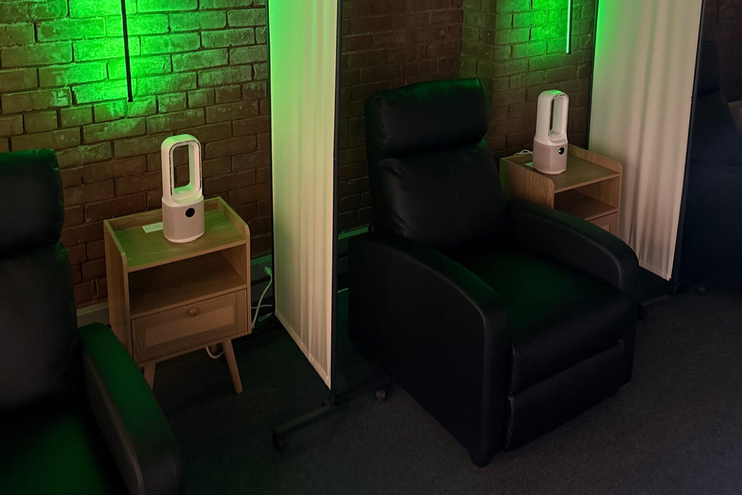black recliners with green light at ketamine clinic