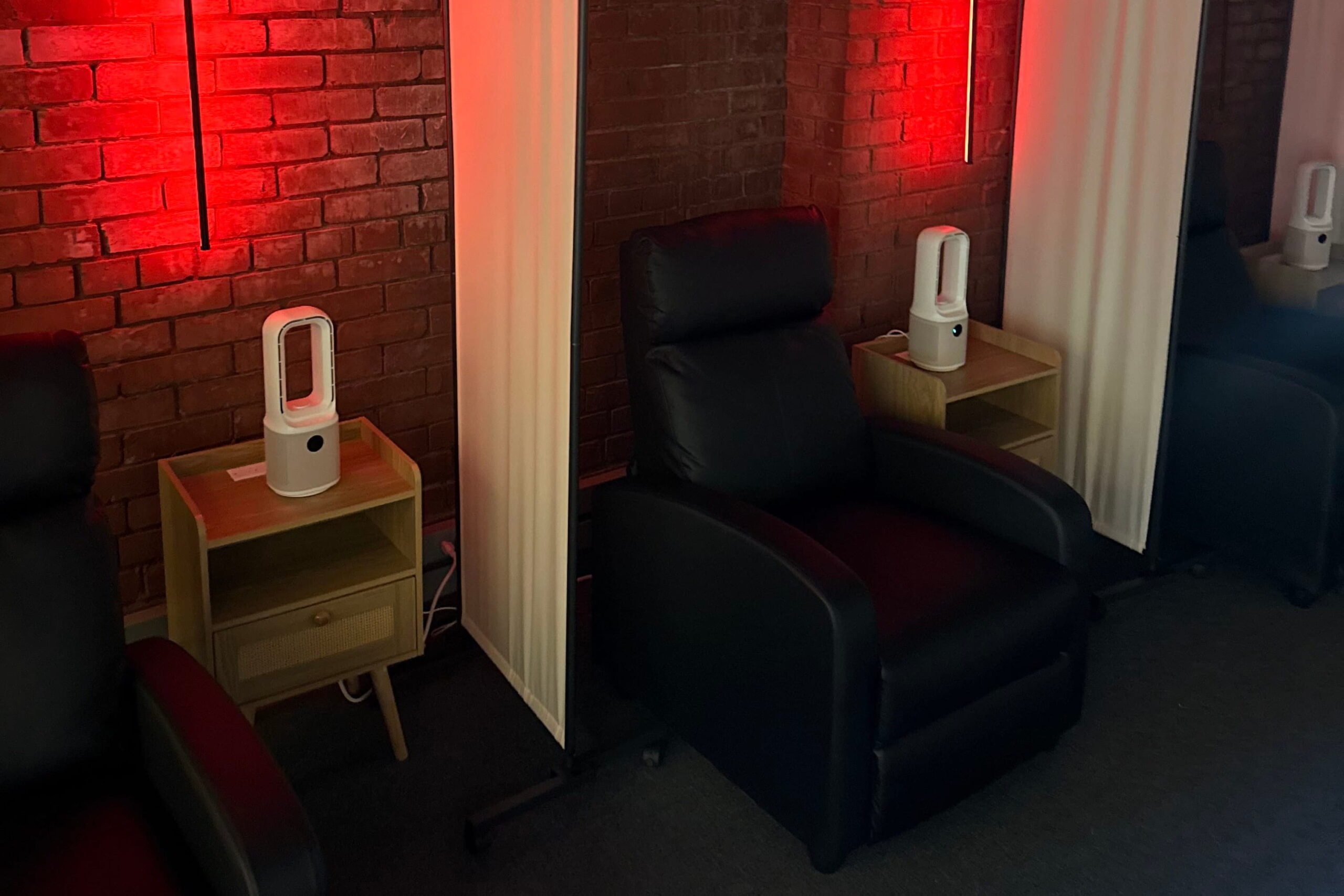 black leather recliners with red lights at ketamine clinic