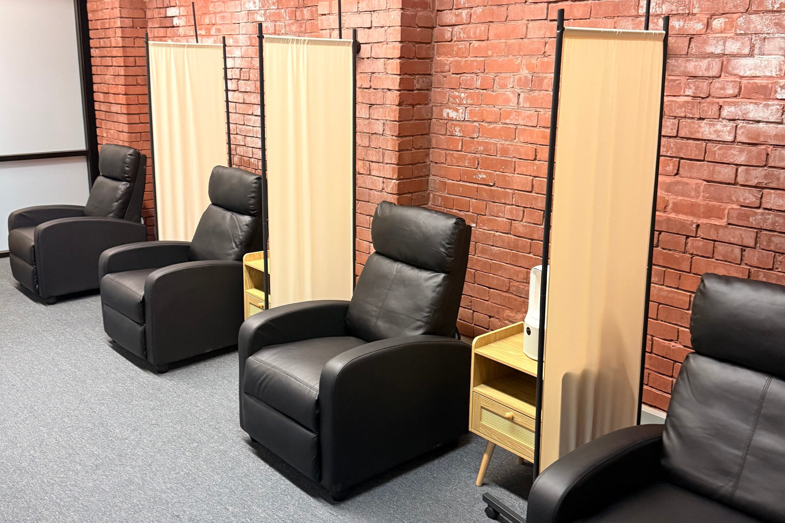 row of black leather recliners at ketamine clinic